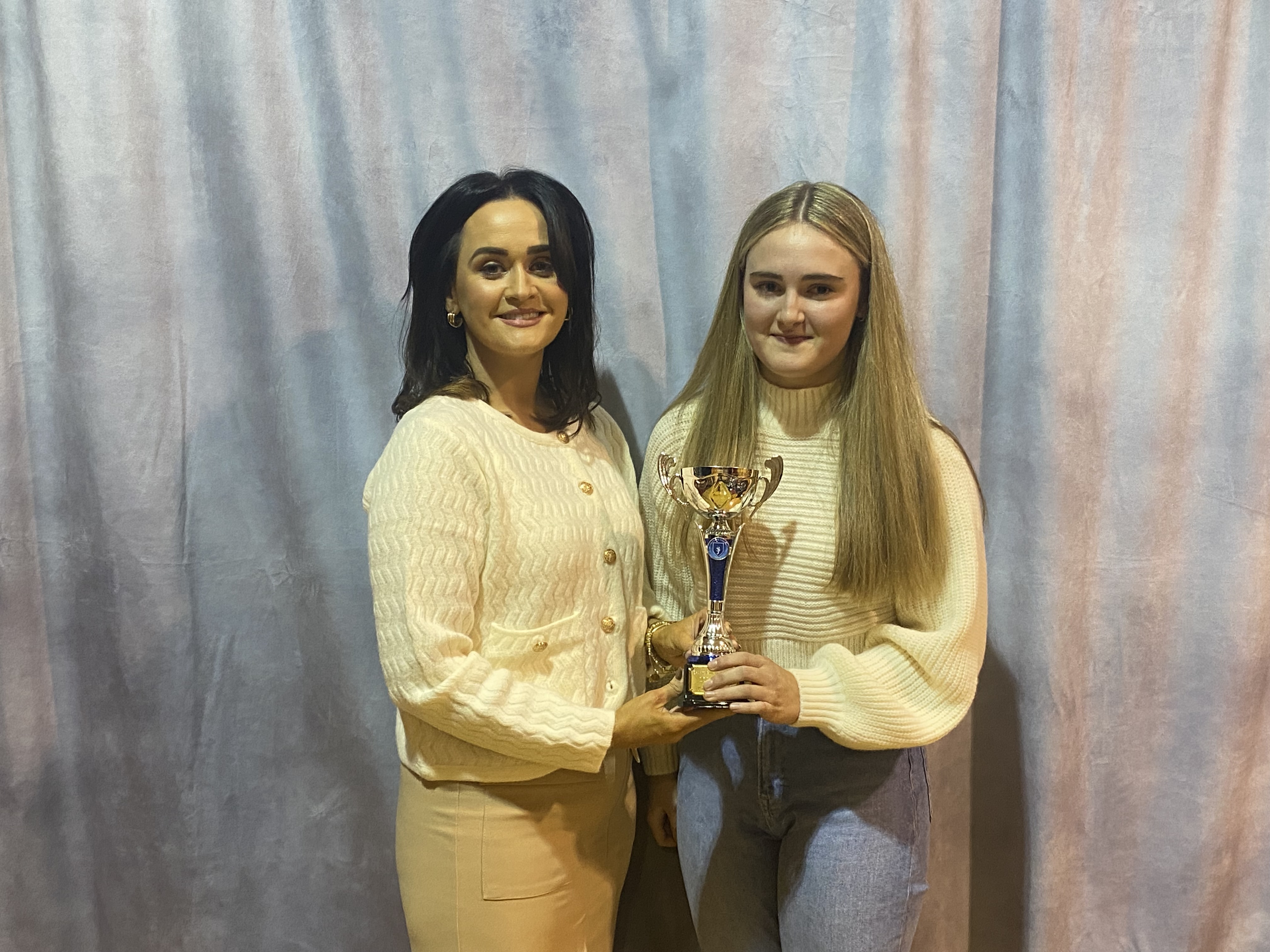 Amy McGinn receives her award (Sports Girl of the Year) by Mrs Deirdre Hackett