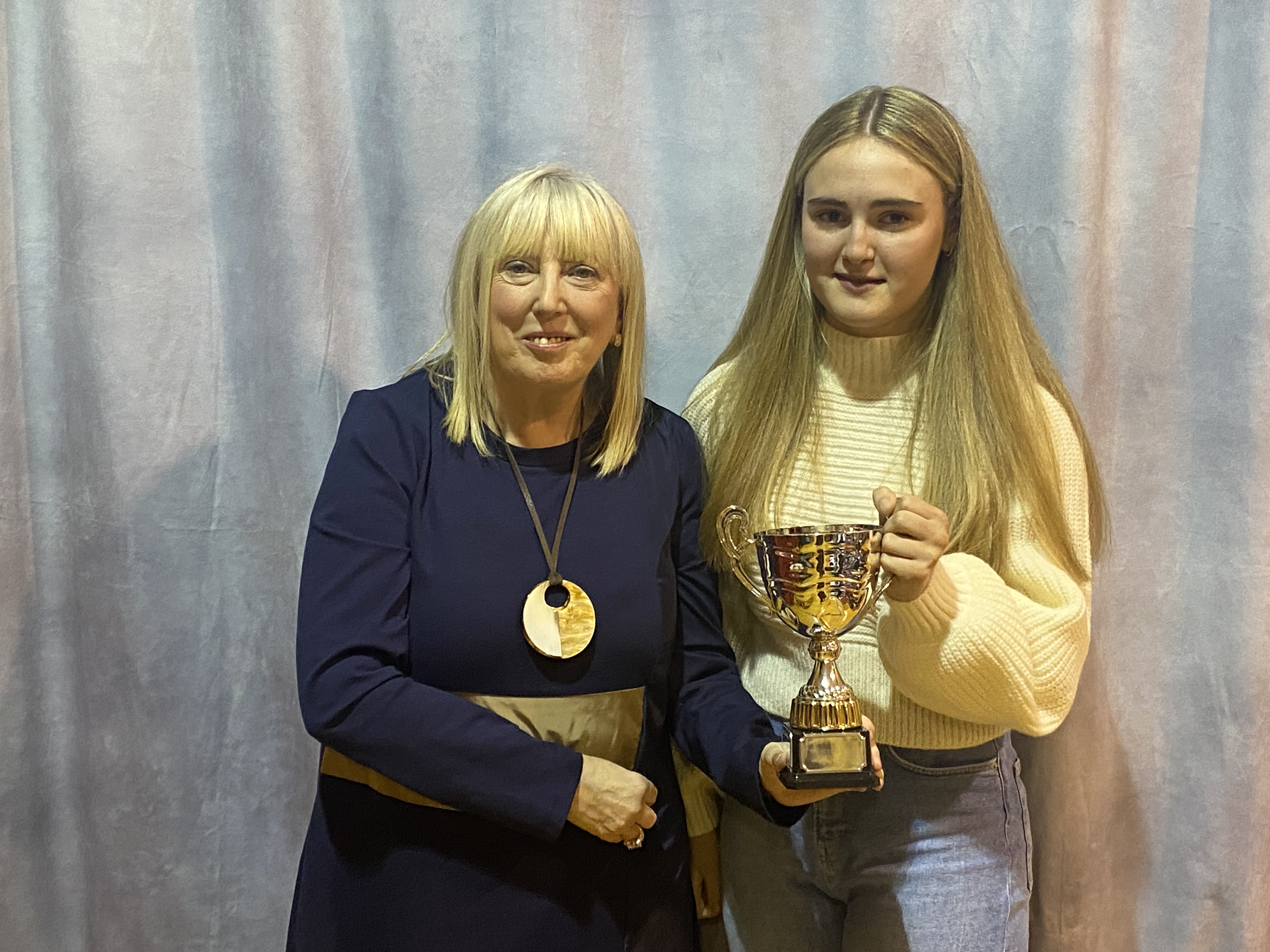 Amy McGinn receives her award (Top GCSE in Physical Education) by Ms Christine Doherty, Principal
